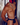 DNGEON men’s black faux leather jockstrap harness – side view with chain necklace – muscular model wearing red pup hood mask